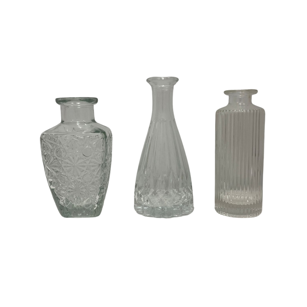 Vases en verre transparent dépareillés trio