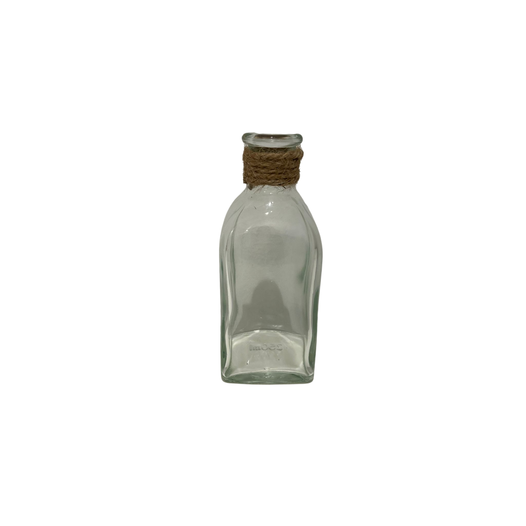 Vase en verre transparent avec de la corde